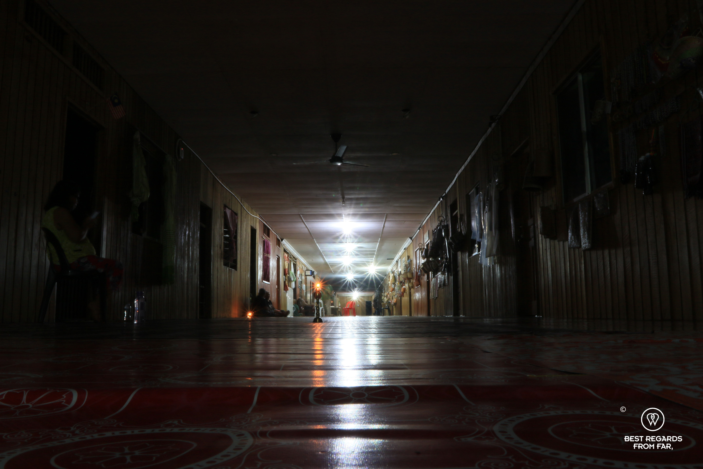 The common area of a traditional longhouse in Nanga Sumpa-Borneo by night.