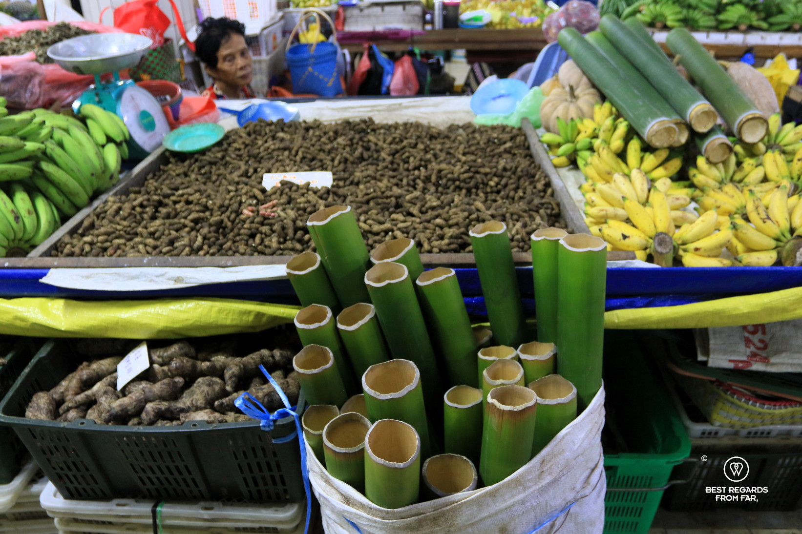 Hollow parts of bamboo and fruits on a local market in Borneo.