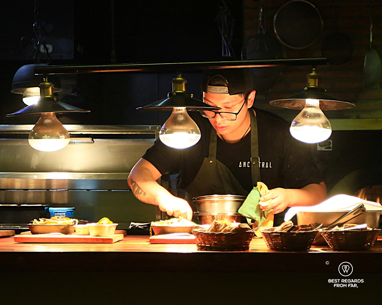 Sous-chef preparing dishes at Ancestral restaurant in La Paz.