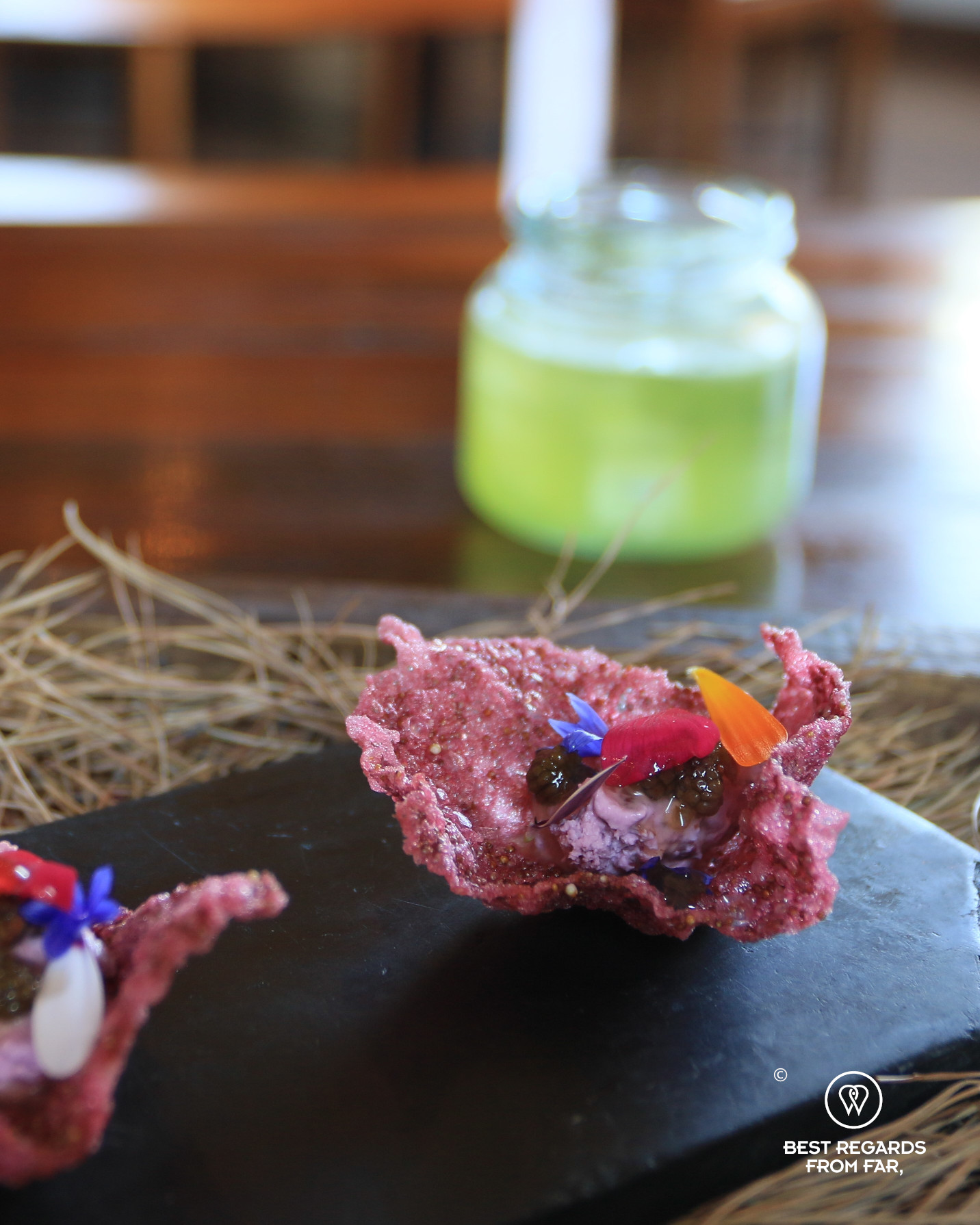 Pink chip of isaño potato appetizer at Gustu restaurant in La Paz.