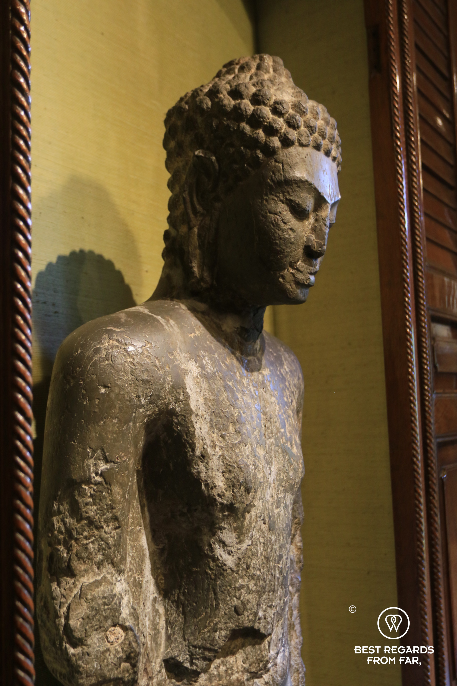 Stone Buddha in Jim Thompson's House, Bangkok.