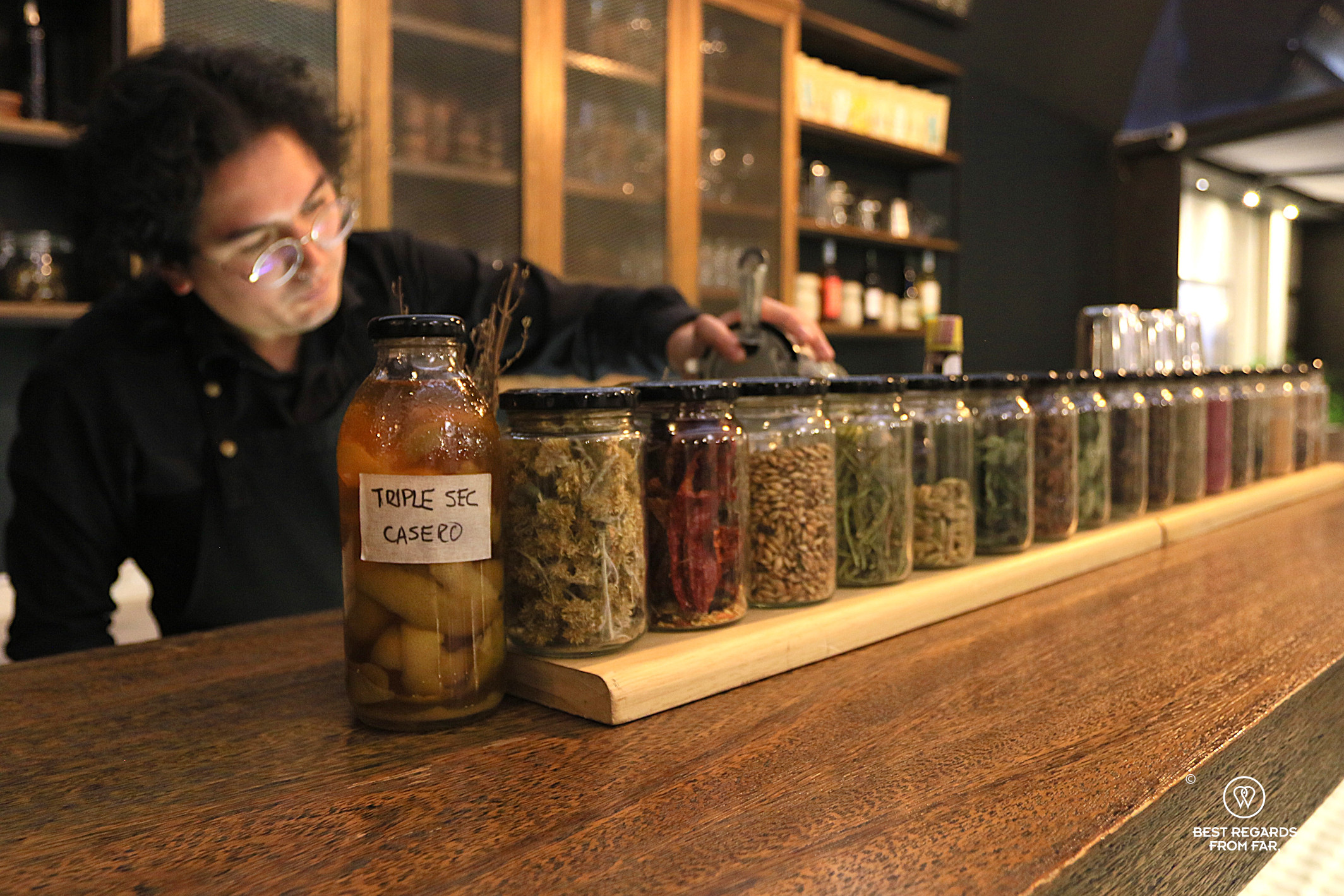 Barman mixing a cocktail at Proyecto Nativa restaurant in La Paz.