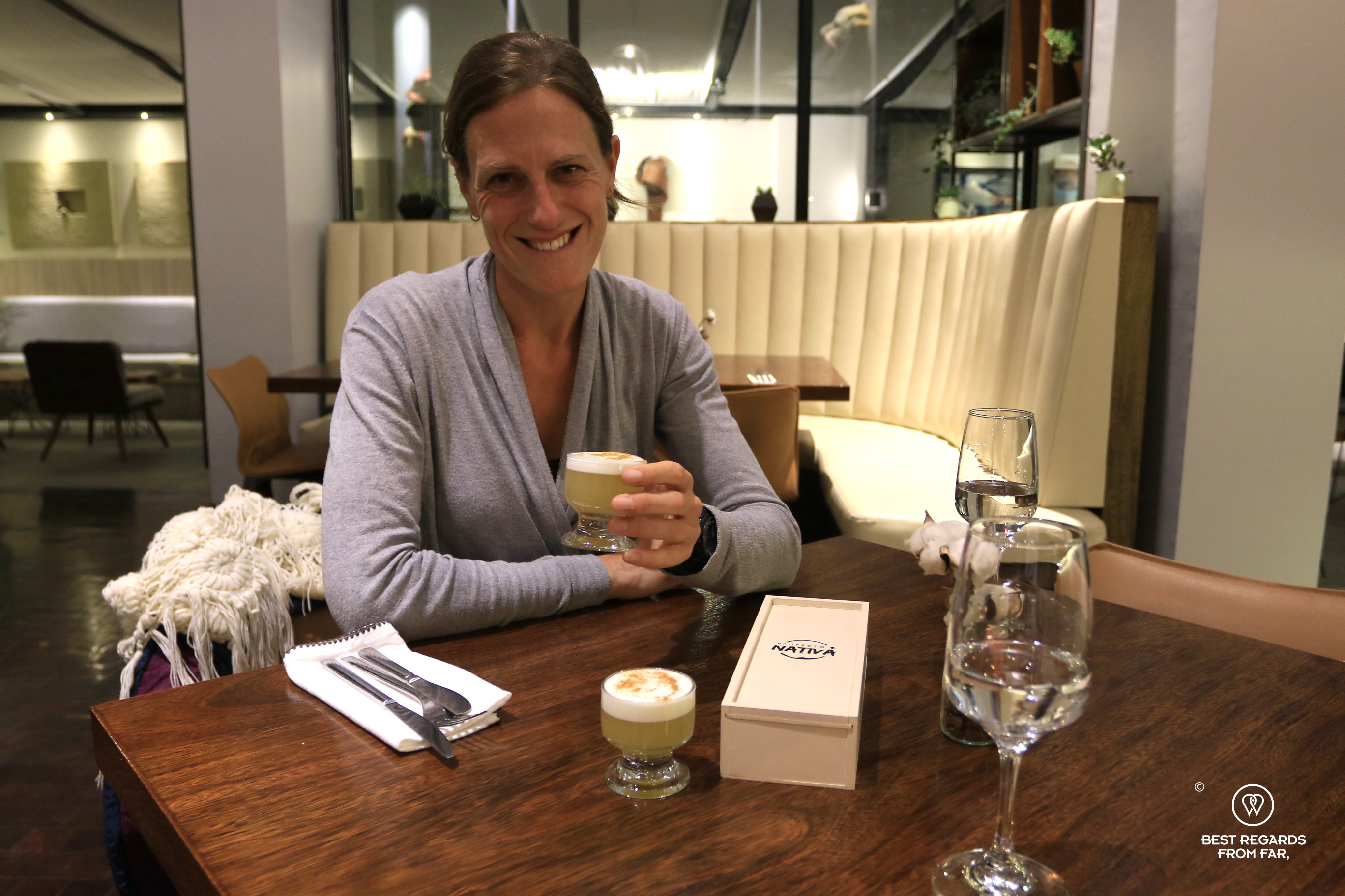 Author Marcella van Alphen cheering at Proyecto Nativa restaurant in La Paz.