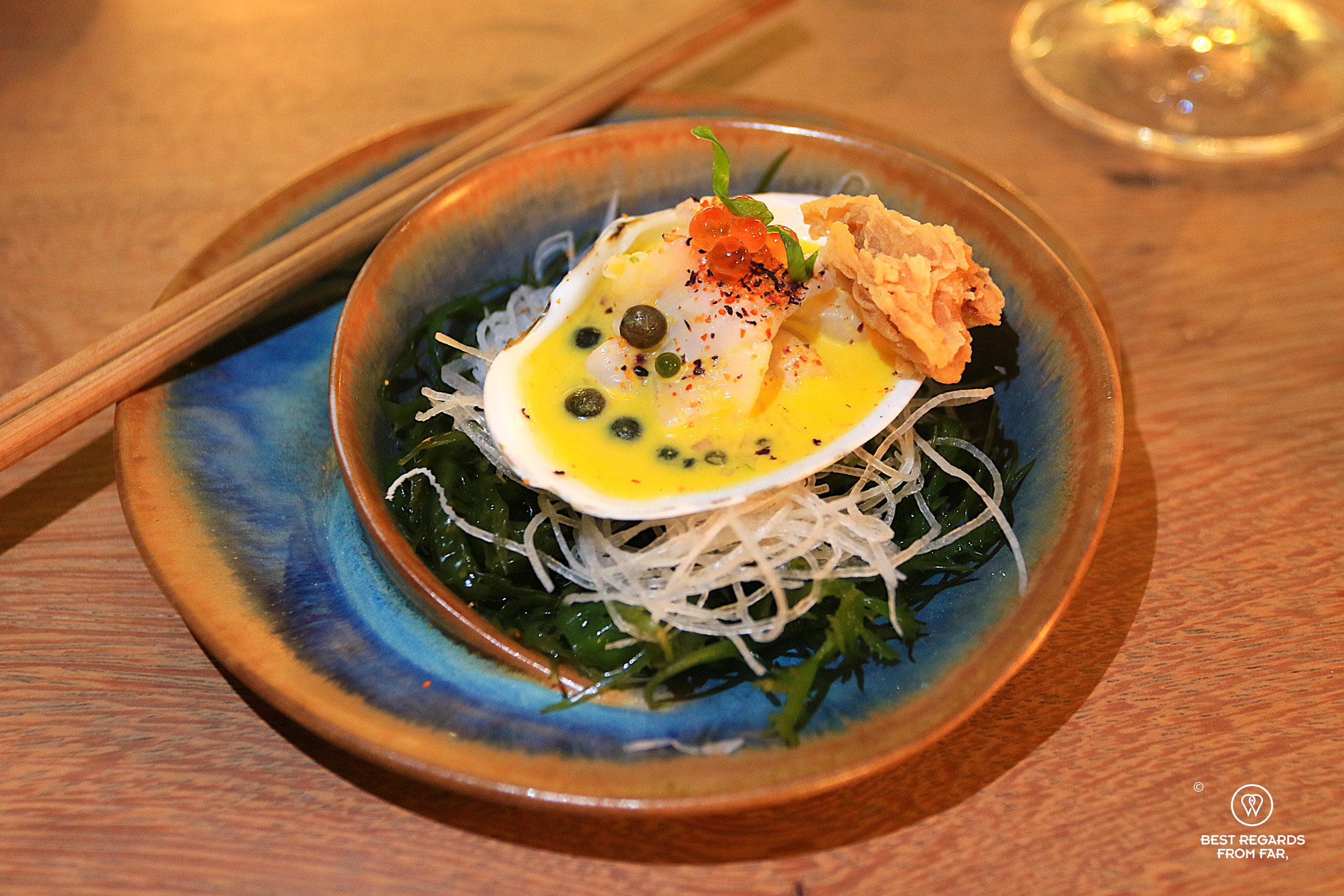 Beatifully plated clam at Tomo restaurant in Lima, Miraflores.