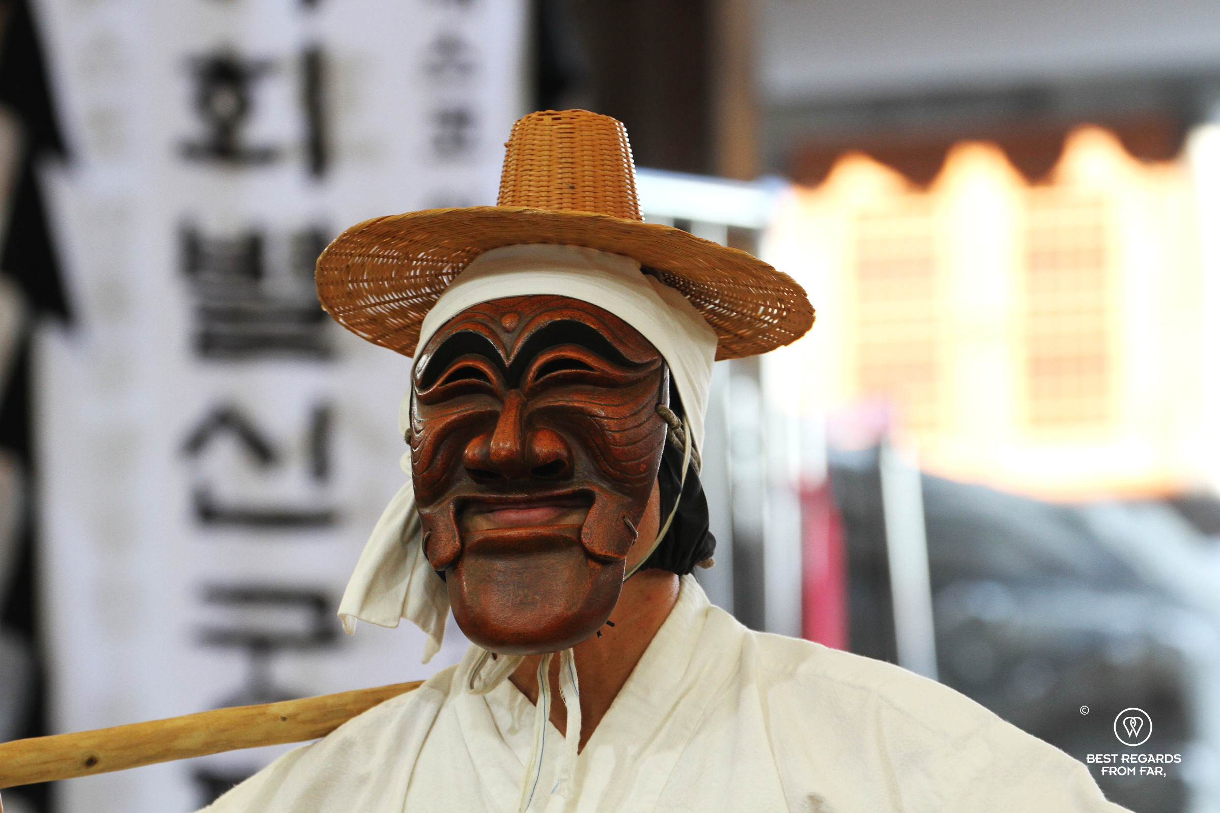 Close up of the butcher dancing the Hahoe Mask Dance and wearing his traditional wooden mask.