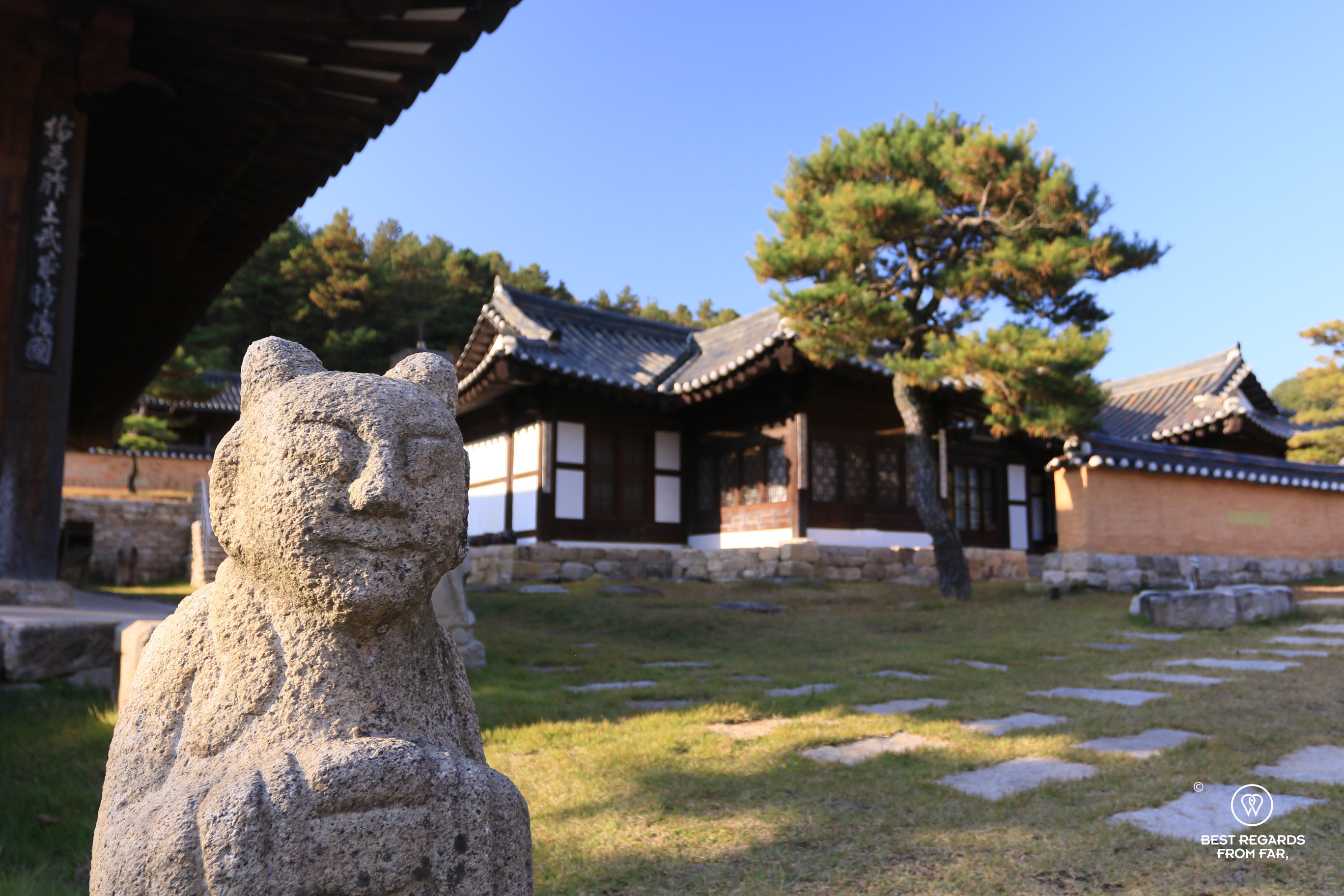 Cat-looking stone statue on the hotel grounds of the Hahoe Rakkojae hanok hotel.