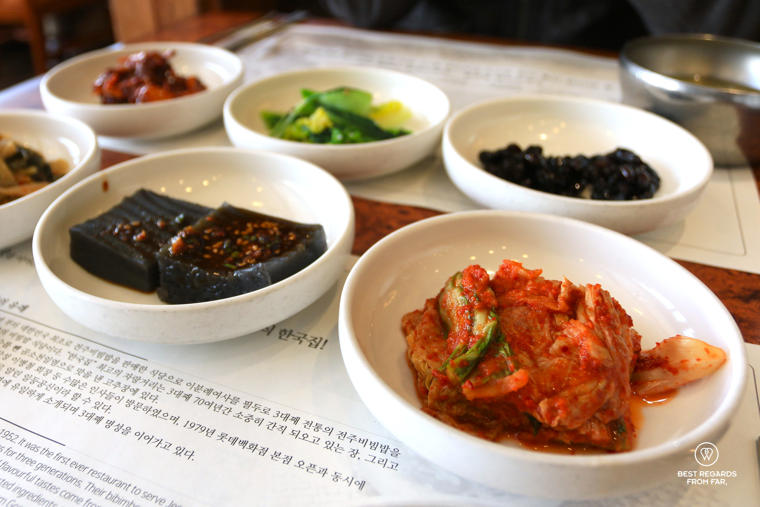 Banchan or side dishes including kimchi.