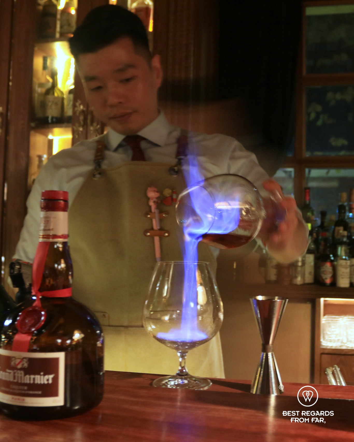 Barman pouring a drink on fire at the Cobbler Bar in Yeonhee in Seoul.