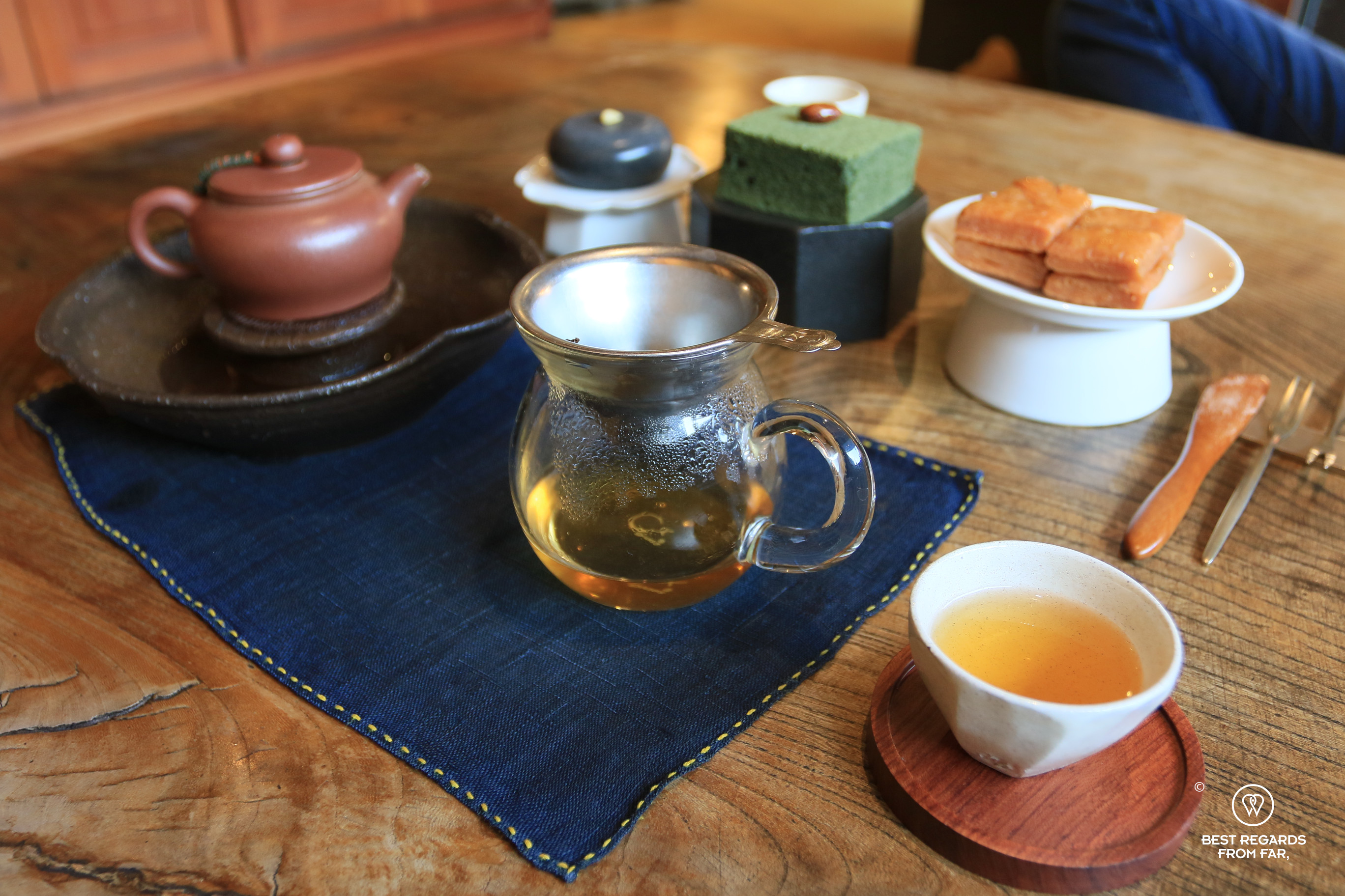 Small tea pots, cups and sweets for a tea tasting at Gyodong Tea Garden in Jeonju.