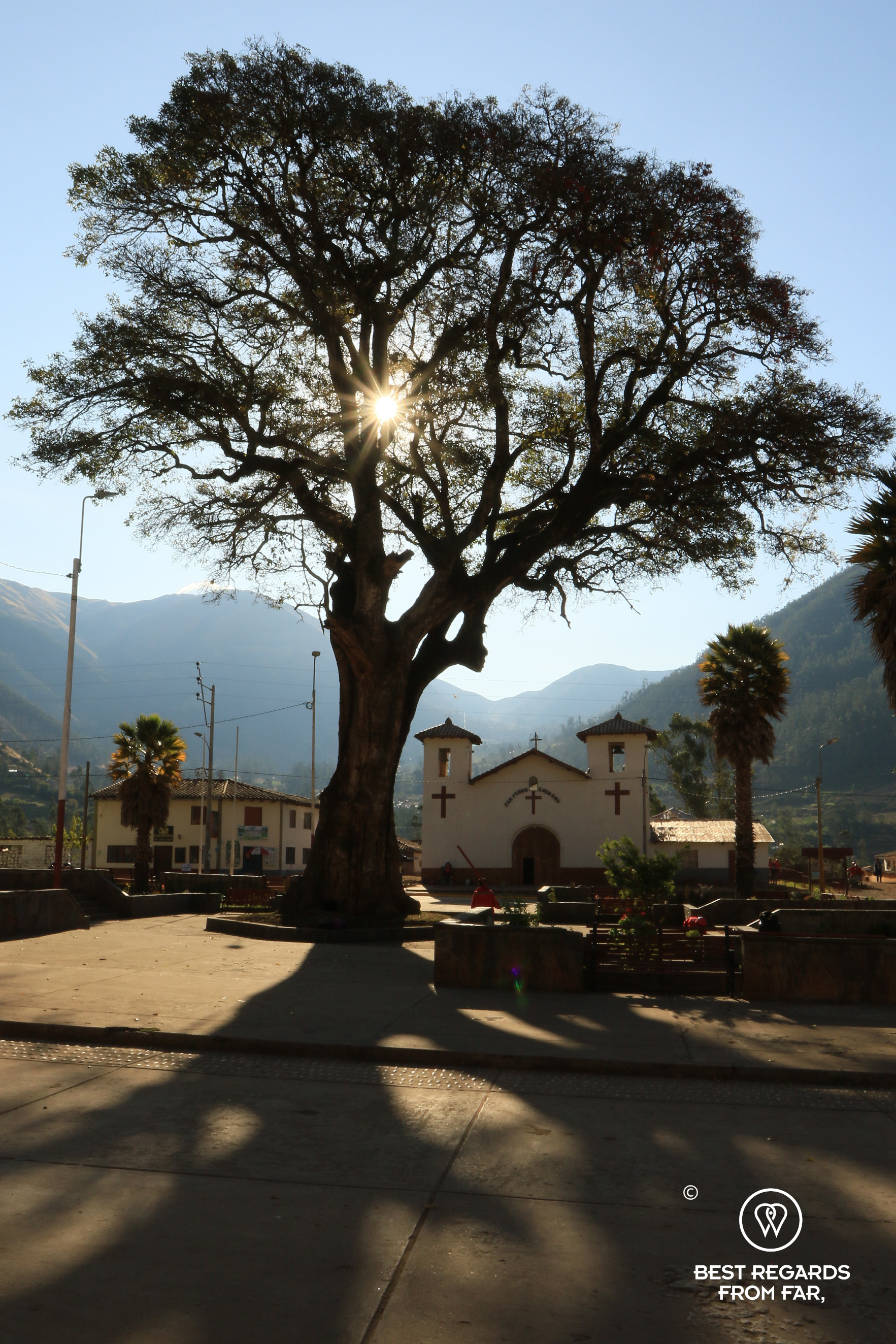 The Plaza de Armas in Cachora with the sun piercing through.