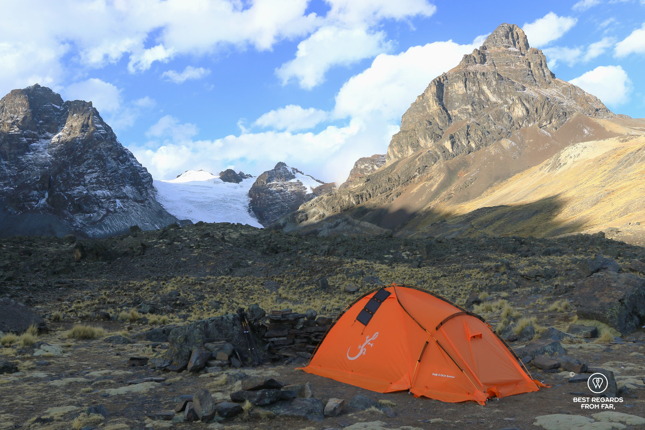 Orange Freetime Outdoor tent and Sunslice solar panel at the Condoriri base camp.