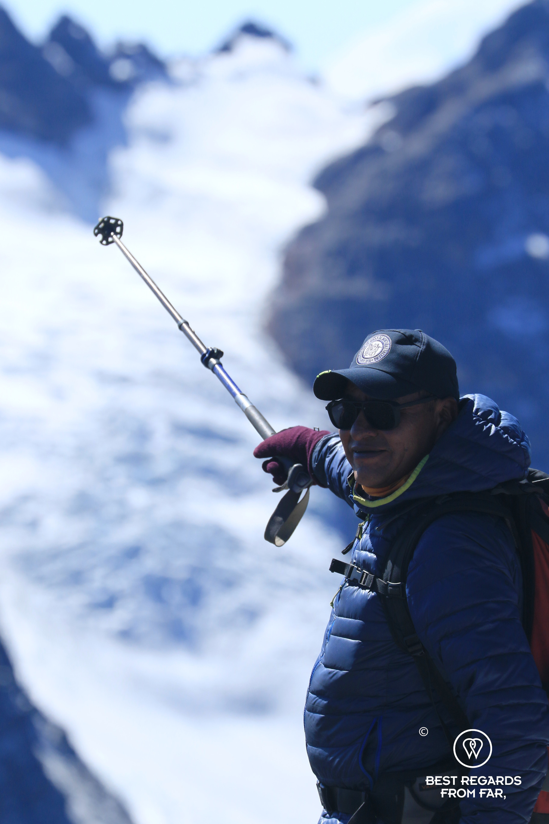 High-mountain guide Nolberto Soliz pointing to Tarija glacier.