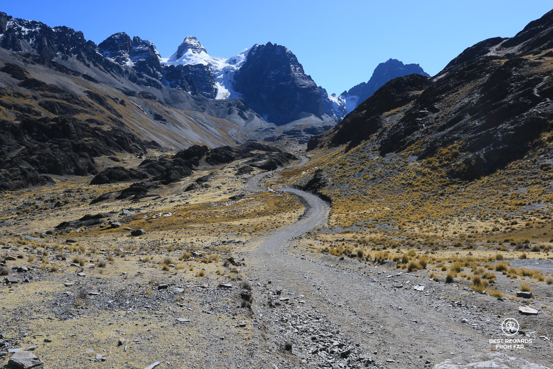 Trail to Condoriri Camp with snow-capped mountains.
