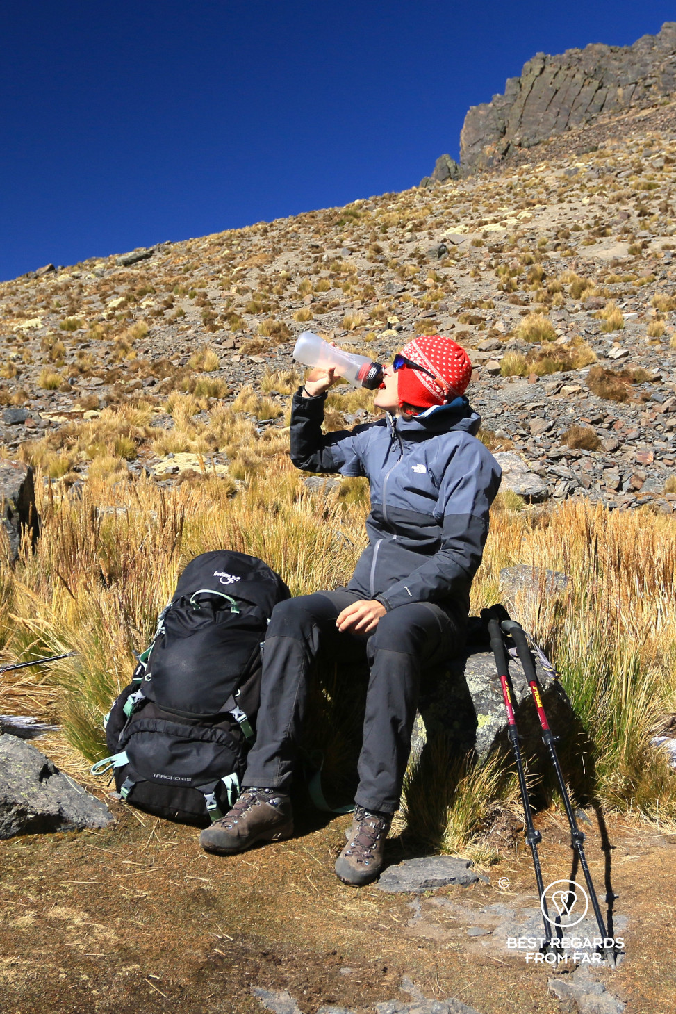 Hiker drinking from ÖKO water filter in the Cordillera Real in Bolivia.