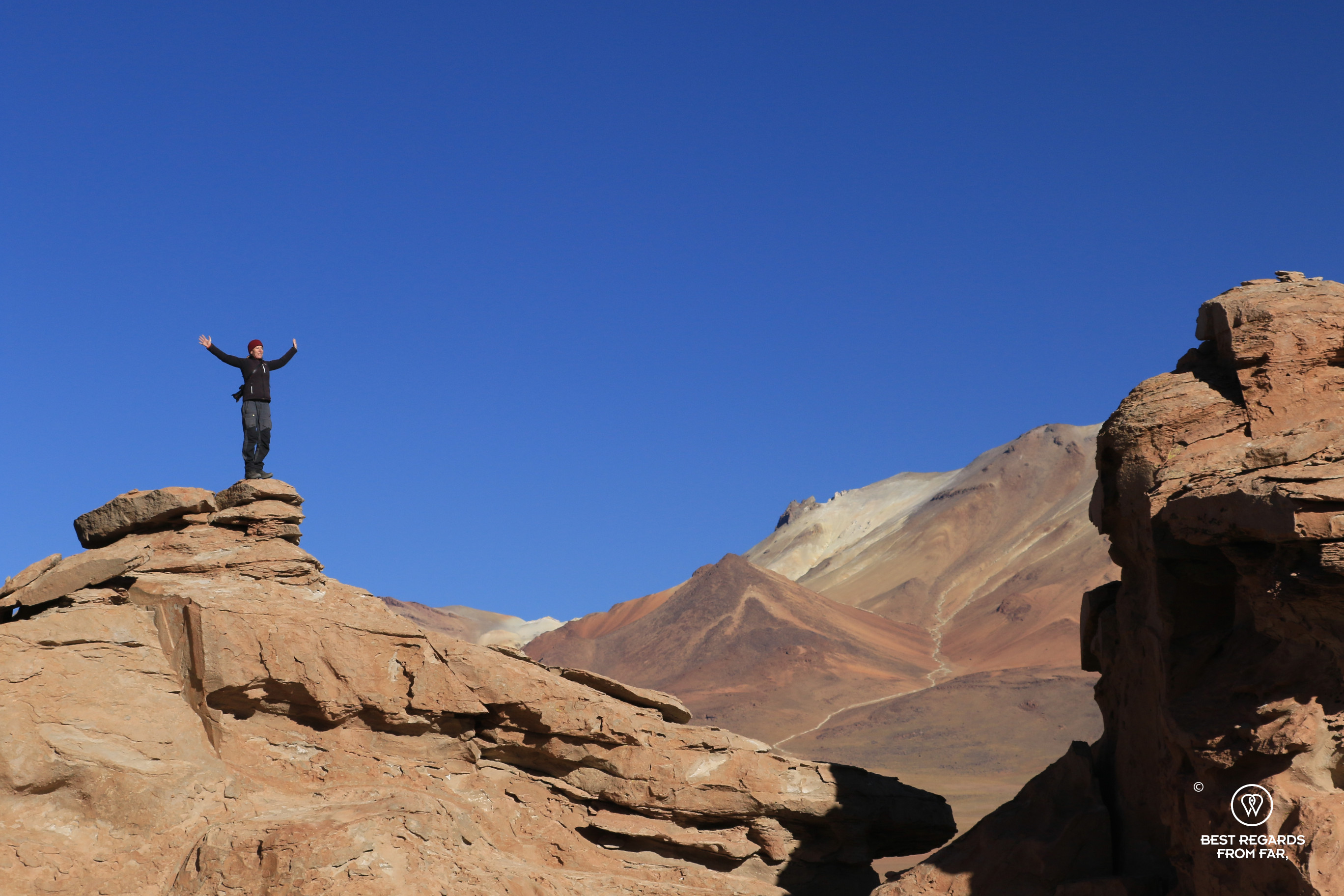 Photographer Claire Lessiau above the stone tree in Bolivia.