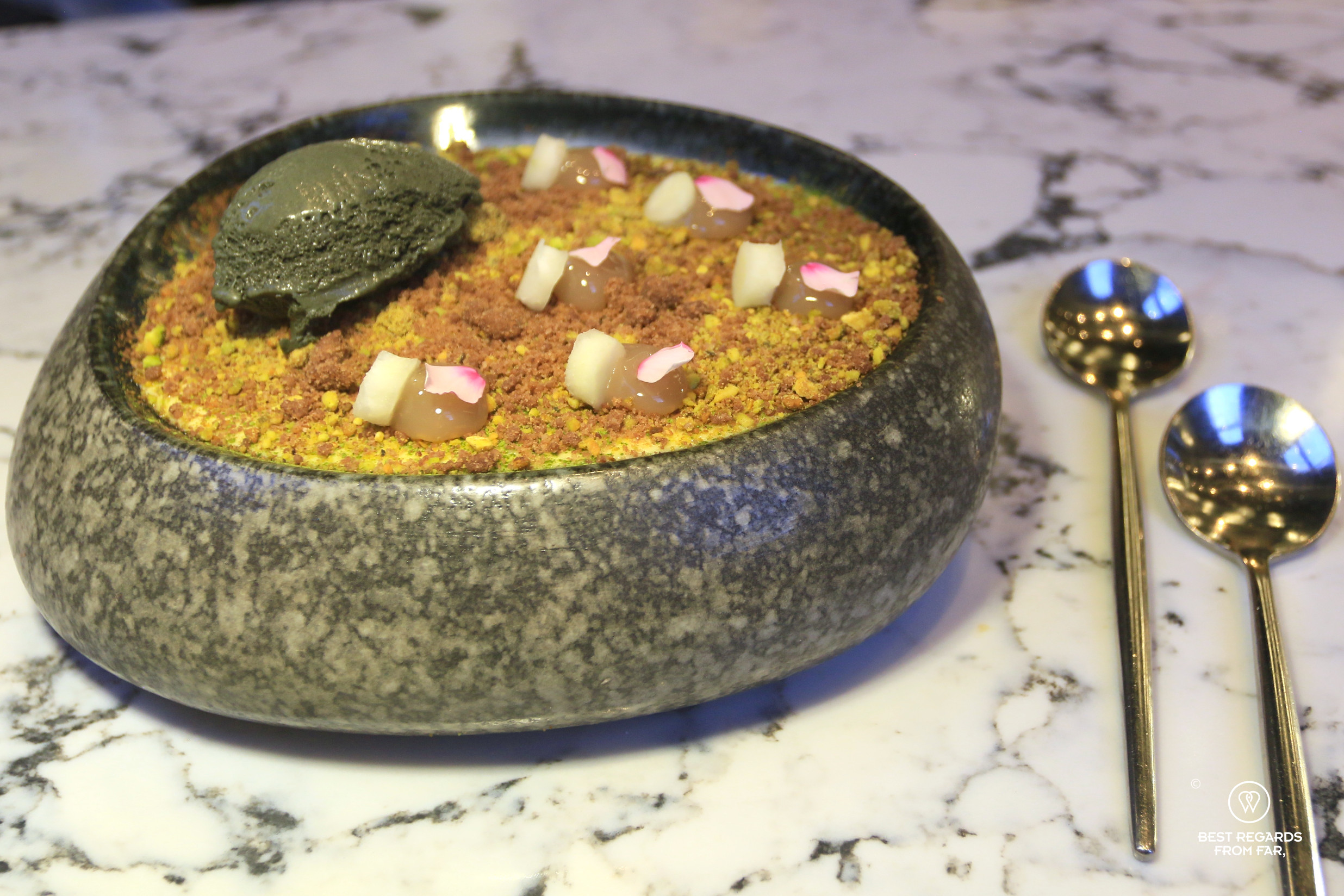 The white chocolate dessert at Nikkei restaurant in Cape Town served in a stone dish.