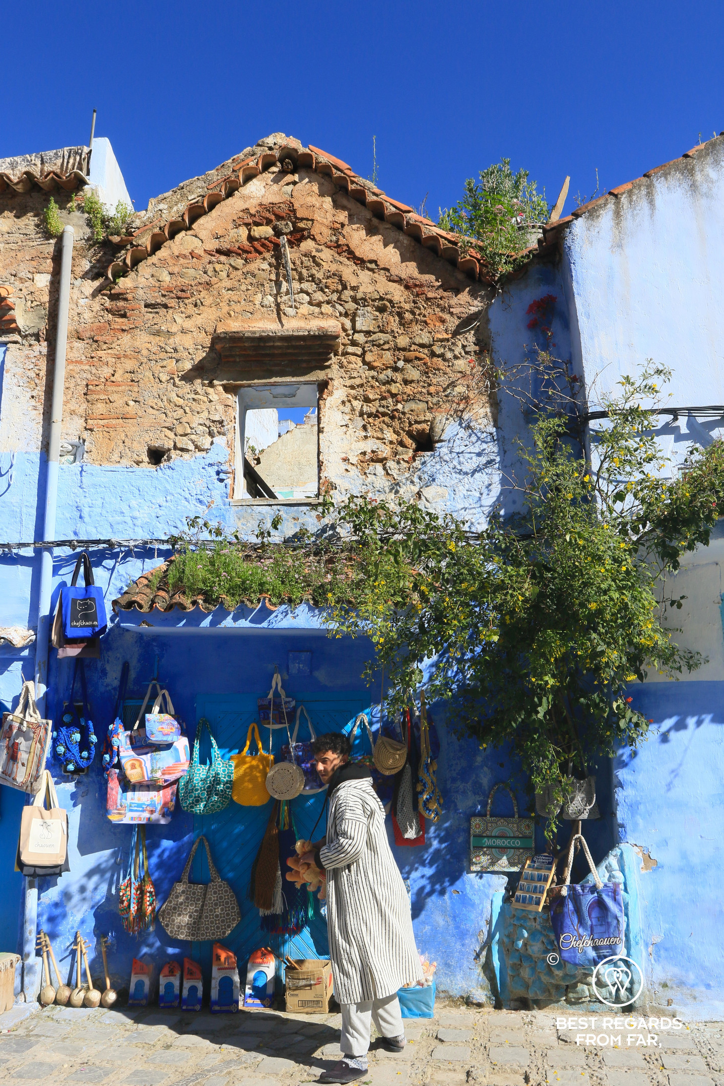 A traditional house in Chefchaouen with the first floor painted in blue.