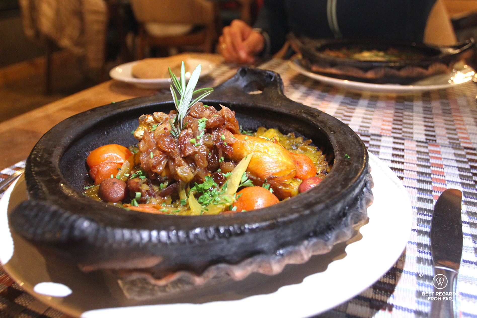 Chicken tajine served in a traditional Moroccan dish at Ermitage d'Akchour.