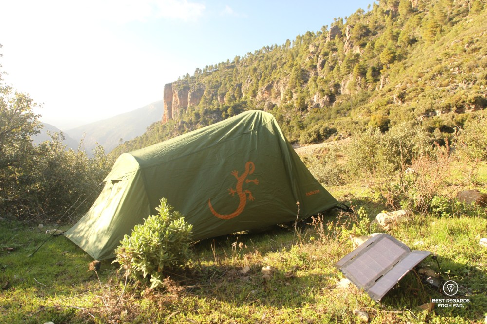 Bivouac at sunset with Freetime Outdoor tent and solar panels in the Rif Mountains.