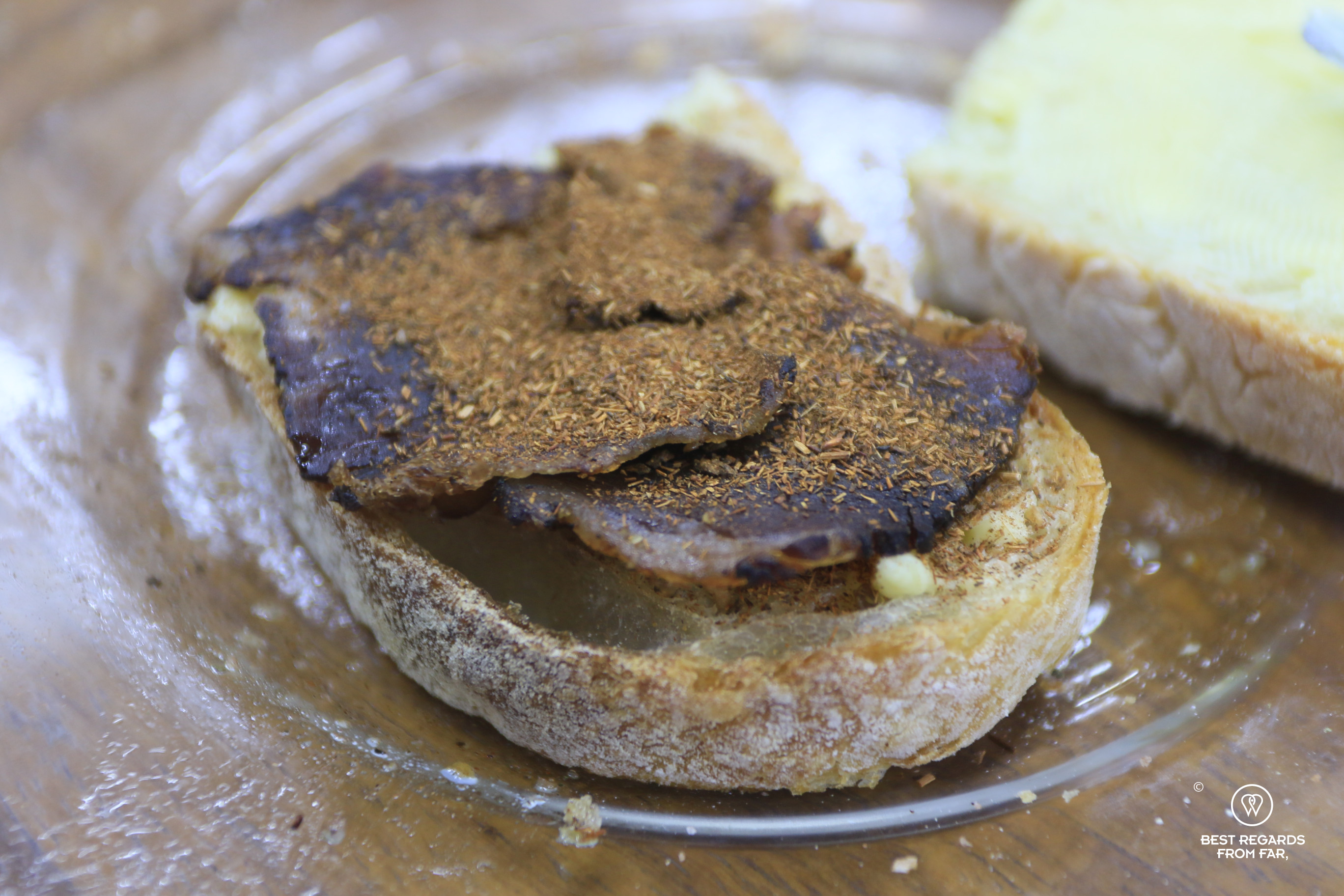 Biltong on a slice of bread sprinkled with fynbos at Cape Town Fynbos Experience.