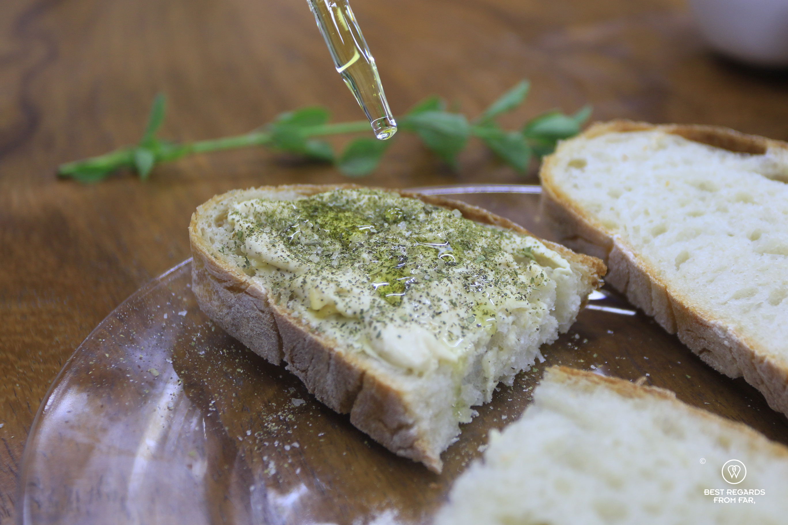 Fynbos sprinkled on bread with olive oil and butter at Cape Town Fynbos Experience.