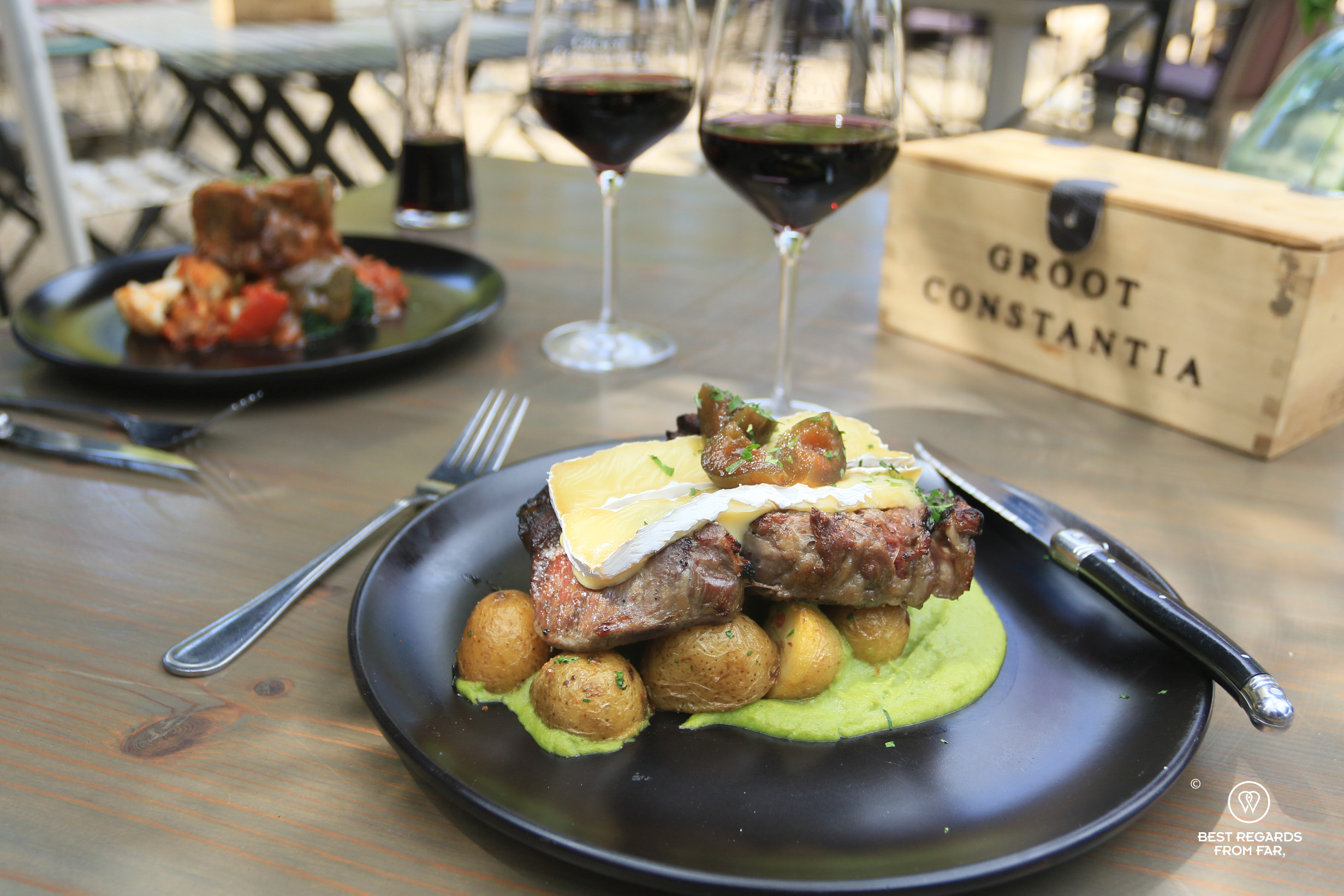 Ribeye and brie with a glass of Groot Constantia shiraz at Simon's restaurant.