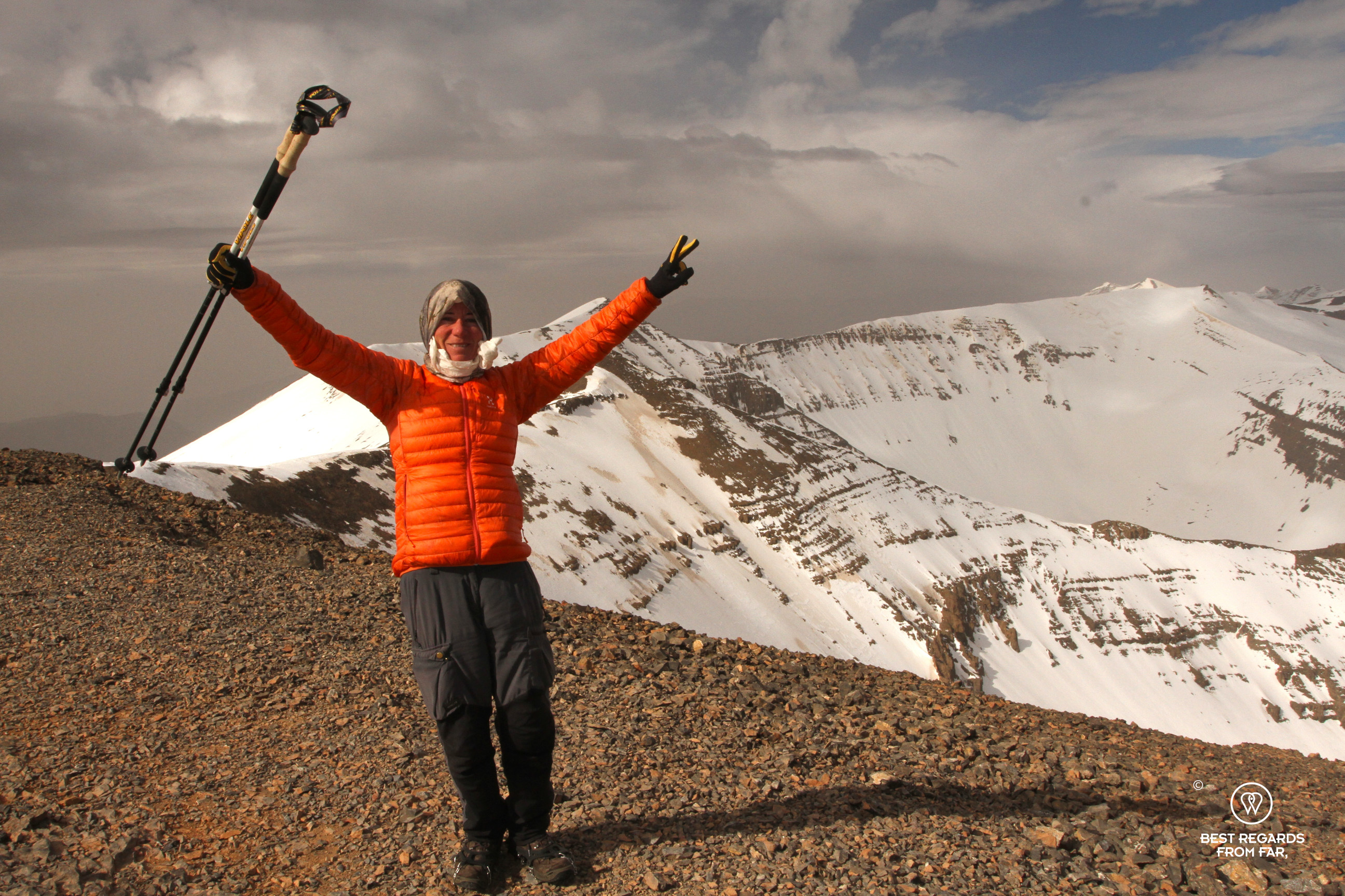 Author Claire Lessiau celebrating on the summit of M'Goun Peak in Morocco.