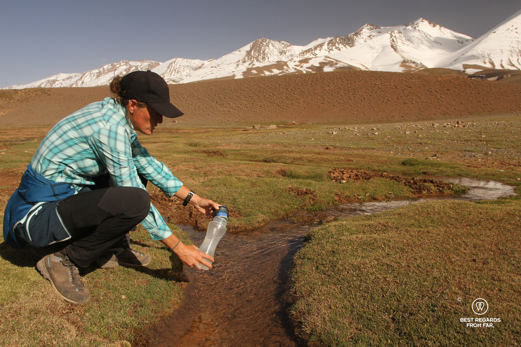 Filtering water in a stream at the foot of M'Goun with an ÖKO water filter.