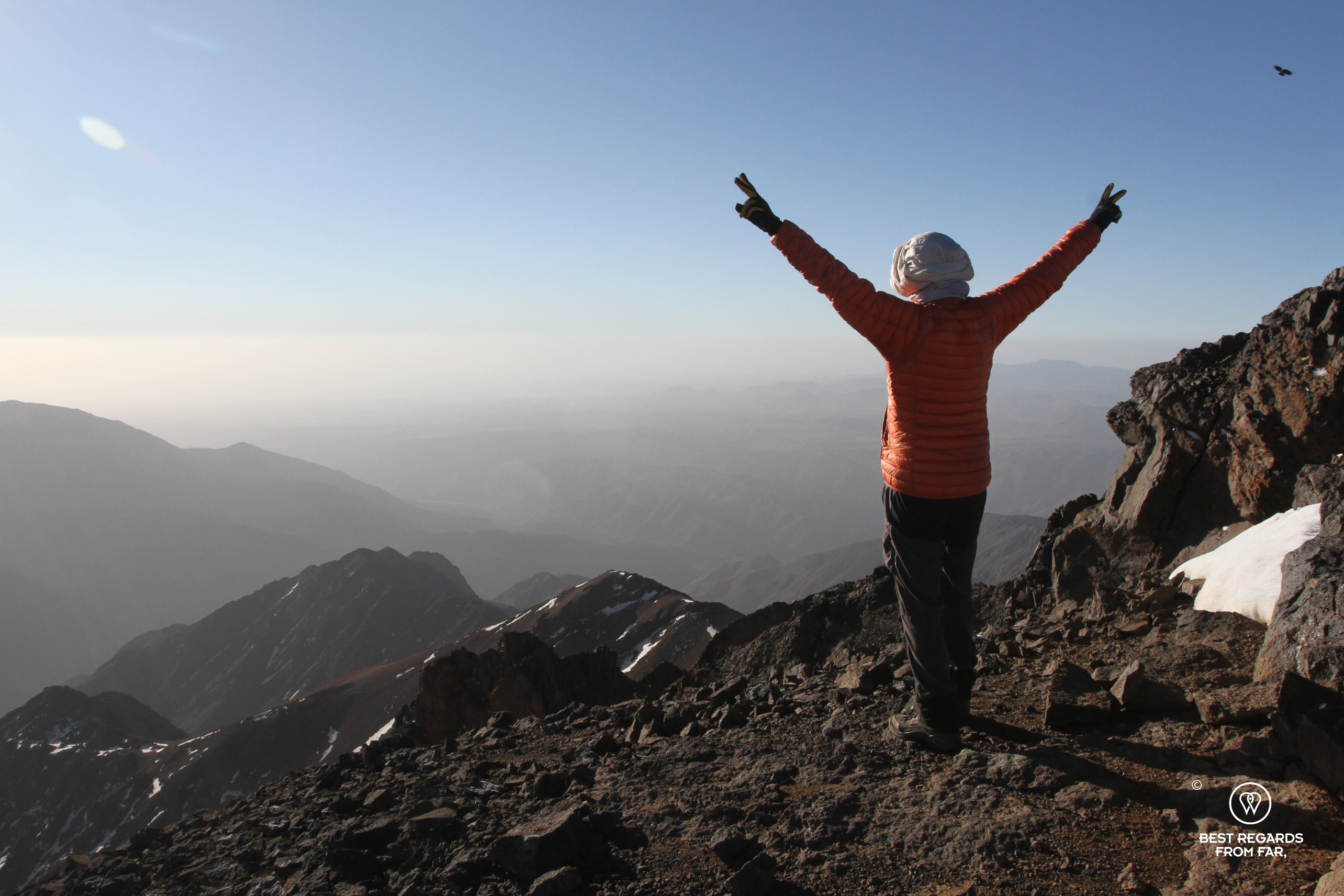 Author Claire Lessiau celebrating on the summit of Toubkal in Morocco.