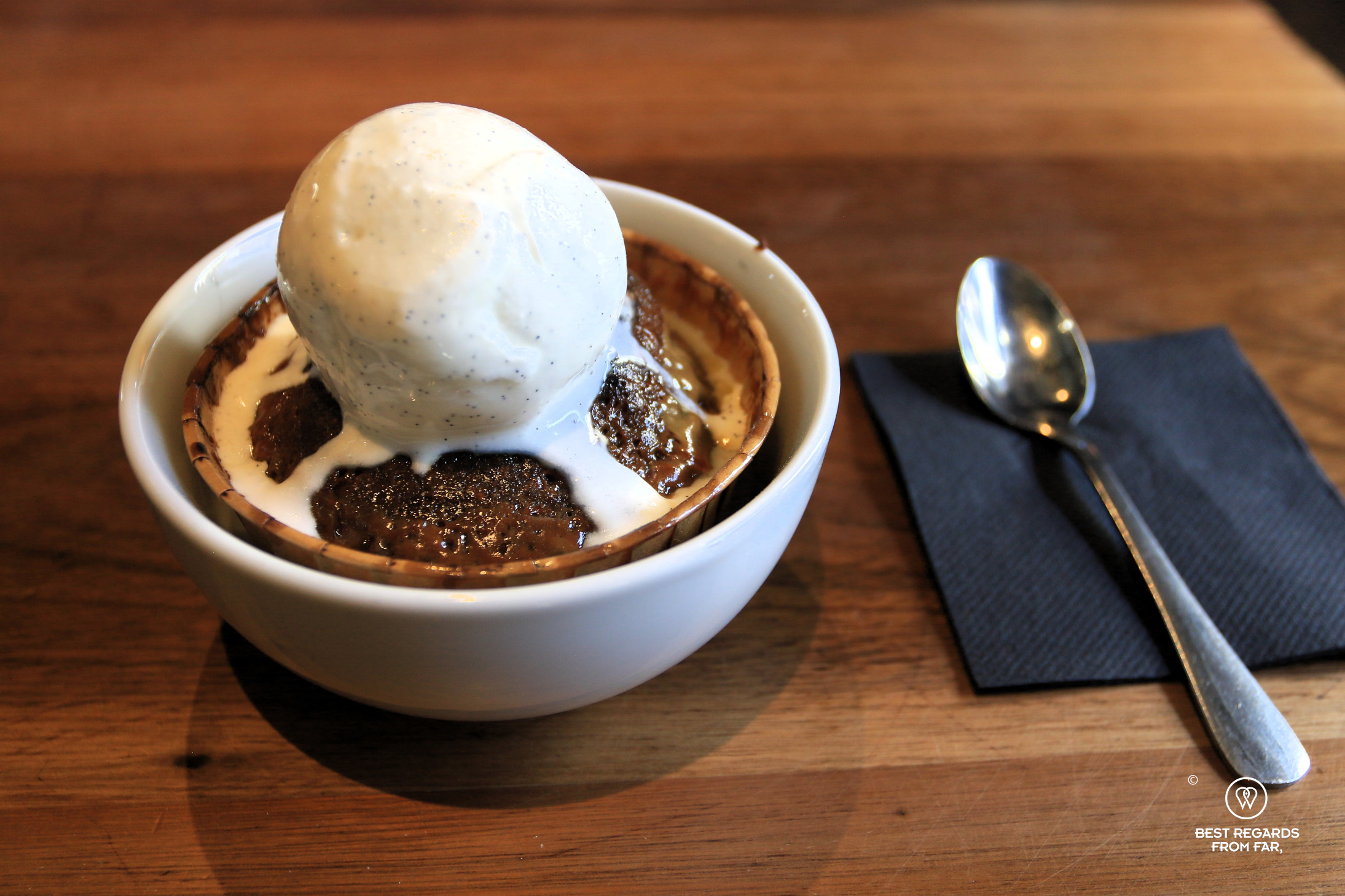 Scoop of ice cream atop a malva pudding at Unframed Ice Creams.
