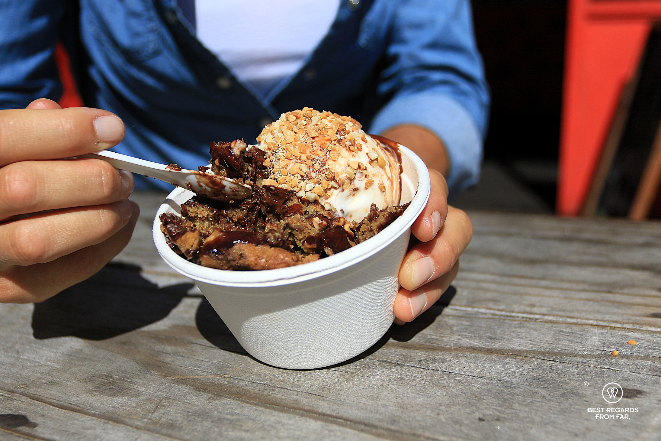 Scooping ice cream from a cup at Unframed Ice Creams on Kloof Street.