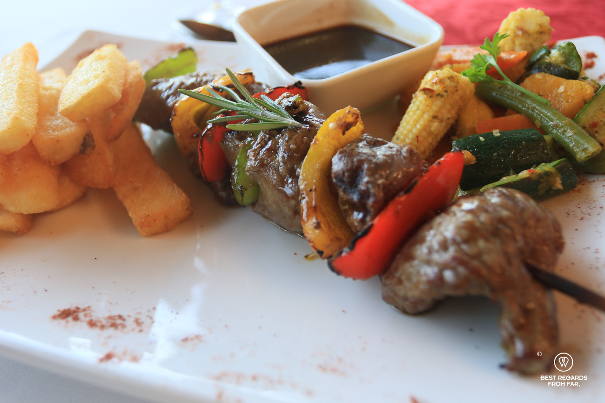 Eland, kudu and ostrich skewer and fries at the Altes Landhaus Lodge in Oudtshoorn in South Africa.