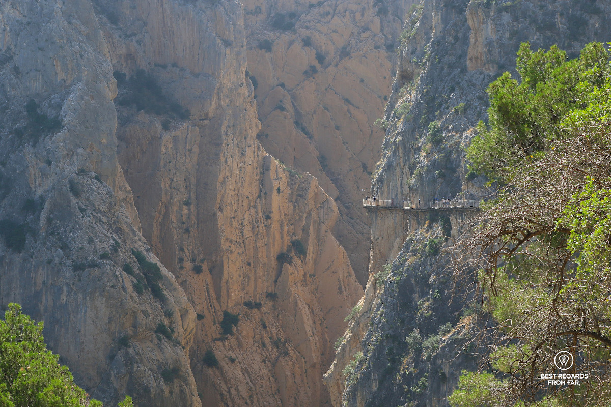 Massive cliffs with the small looking boardwalk in the middle.