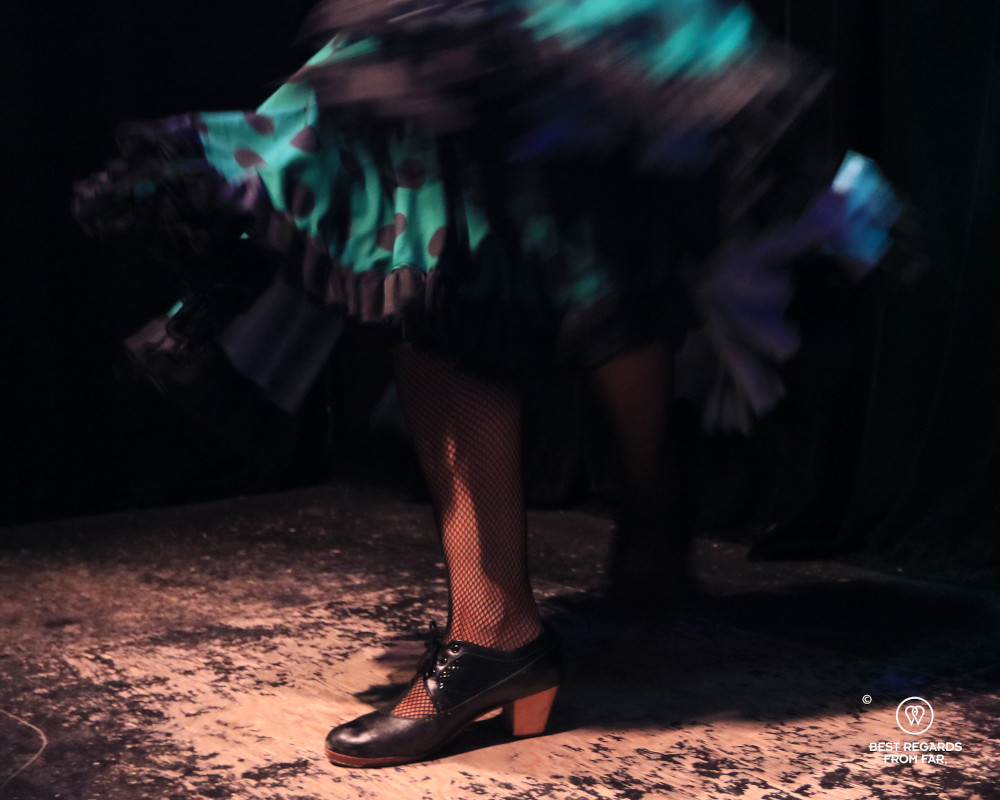 Close up on the footwork of a flamenca dancer.
