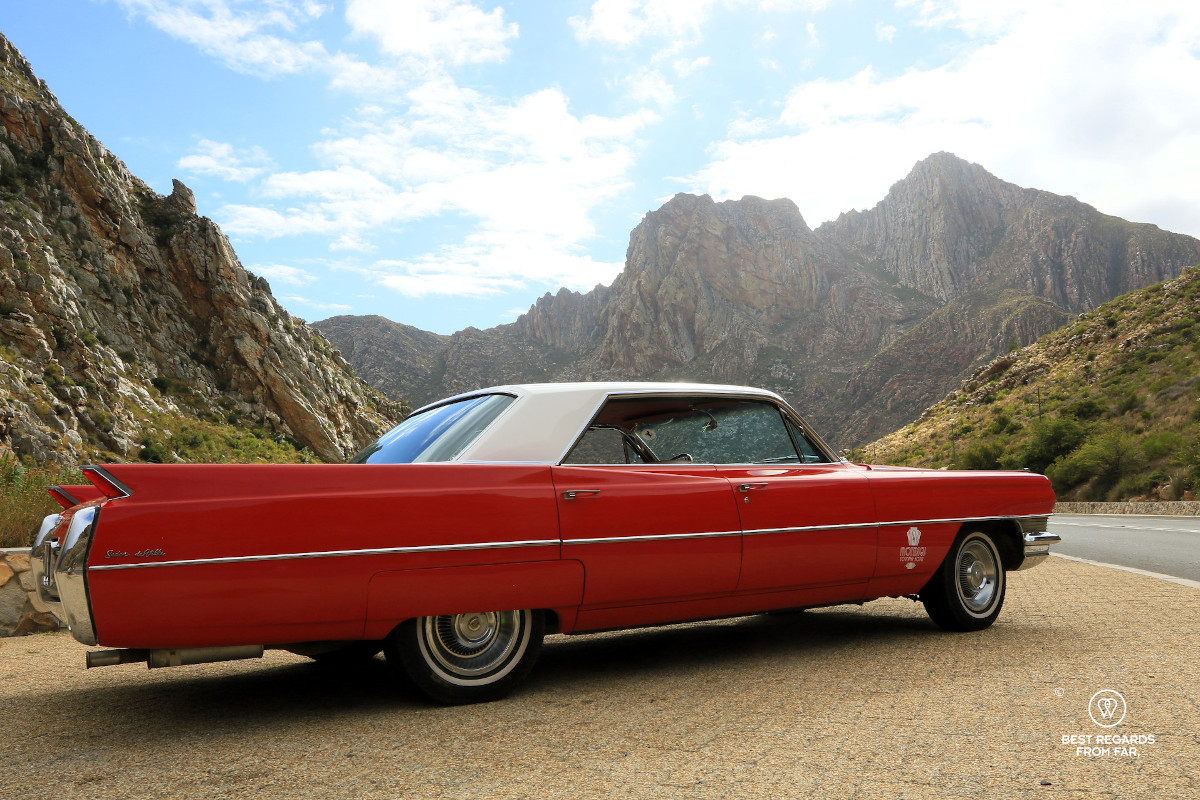 Red Cadillac in front of mountains in South Africa.