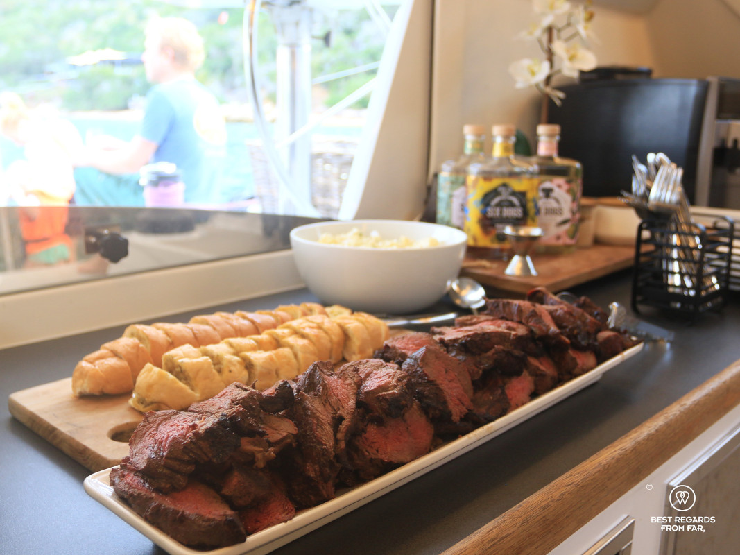 Braaied meat and garlic bread presented by the captain.