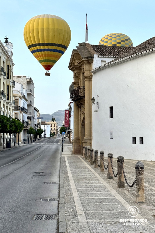 The bullring of Ronda with hot air balloons.