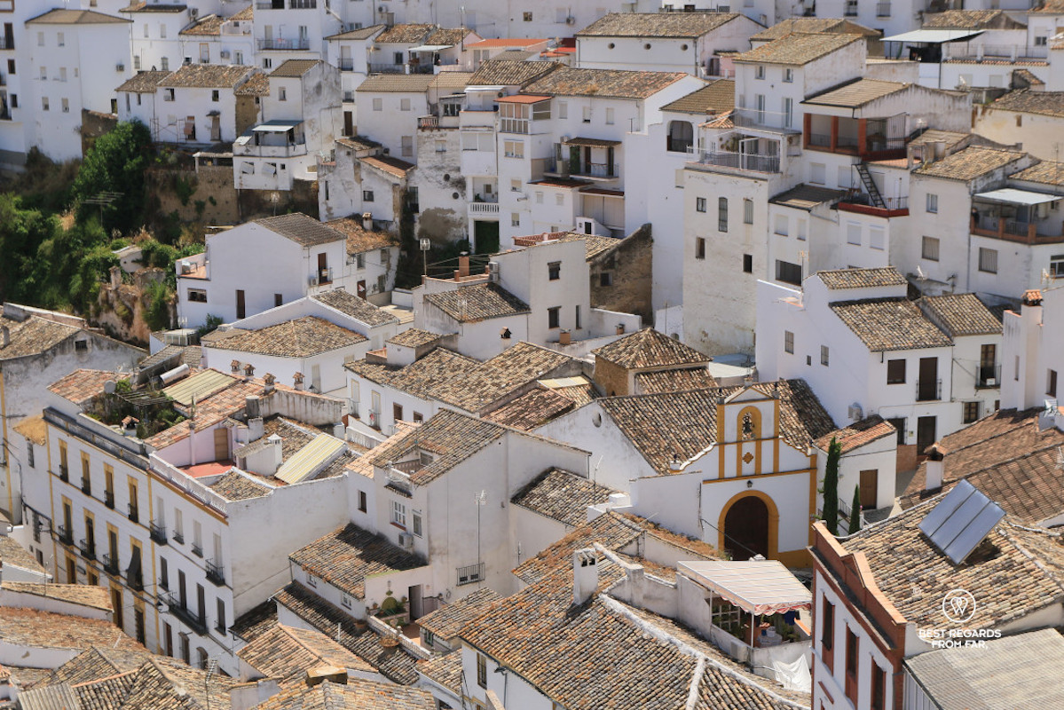 Church and white Andalusian village of Setenil de las Bodegas viewed from the top.