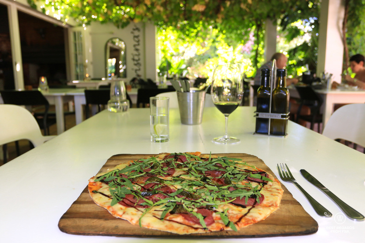 Thin-crusted pizza with springbok and rucola at Christina's Bistro.