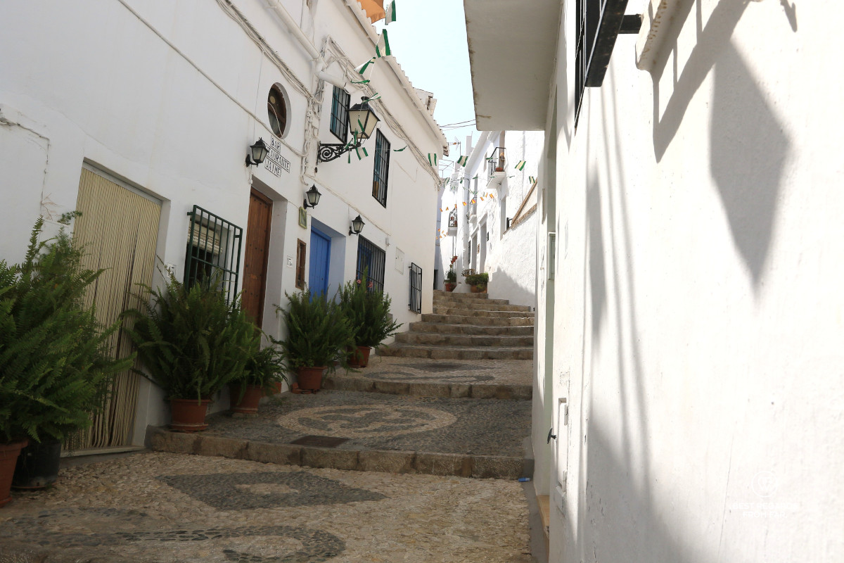 A quiet white street in the white Andalusian village of Frigiliana.