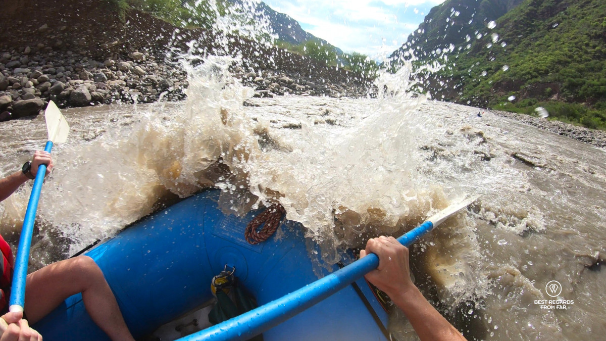 Big splash of water to the bow of the raft on the Chicamocha Canyon in Colombia.