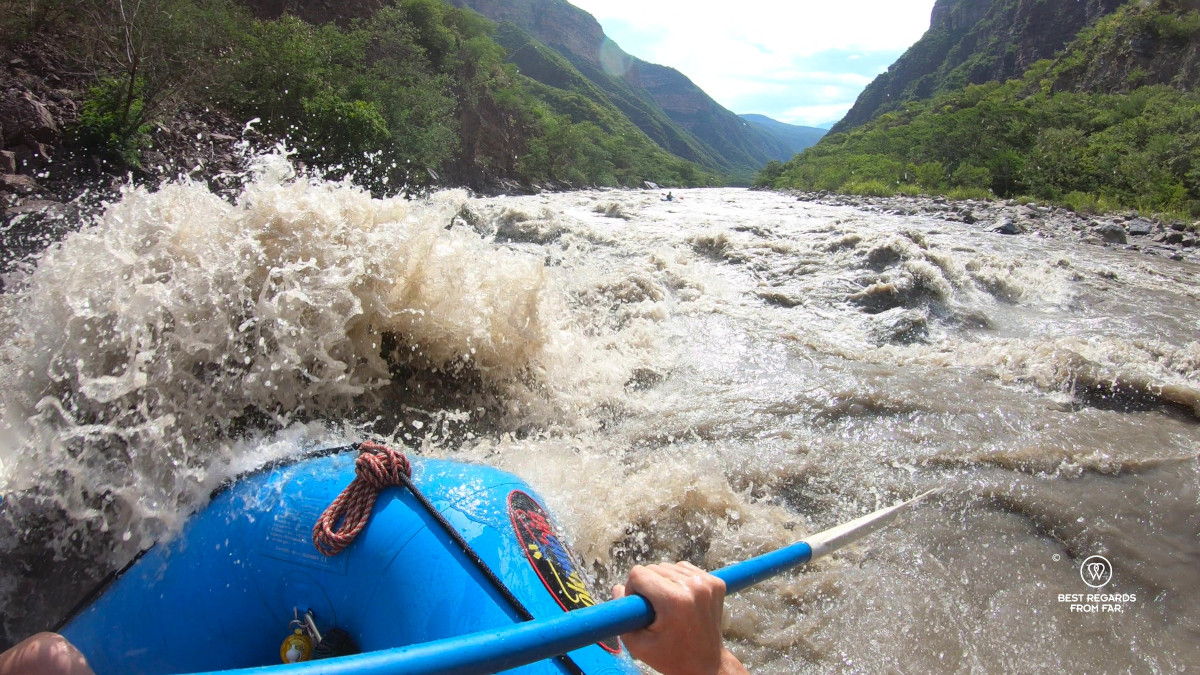 Big wall of water to the bow of the raft on the Chicamocha Canyon in Colombia.