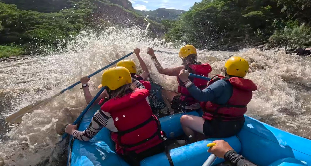 Big wall of water to the bow of the raft on the Chicamocha Canyon in Colombia.