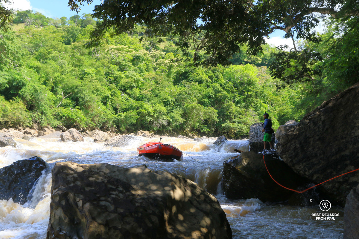 Lowering the raft in Class V rapids on the Rio Suarez in Colombia.