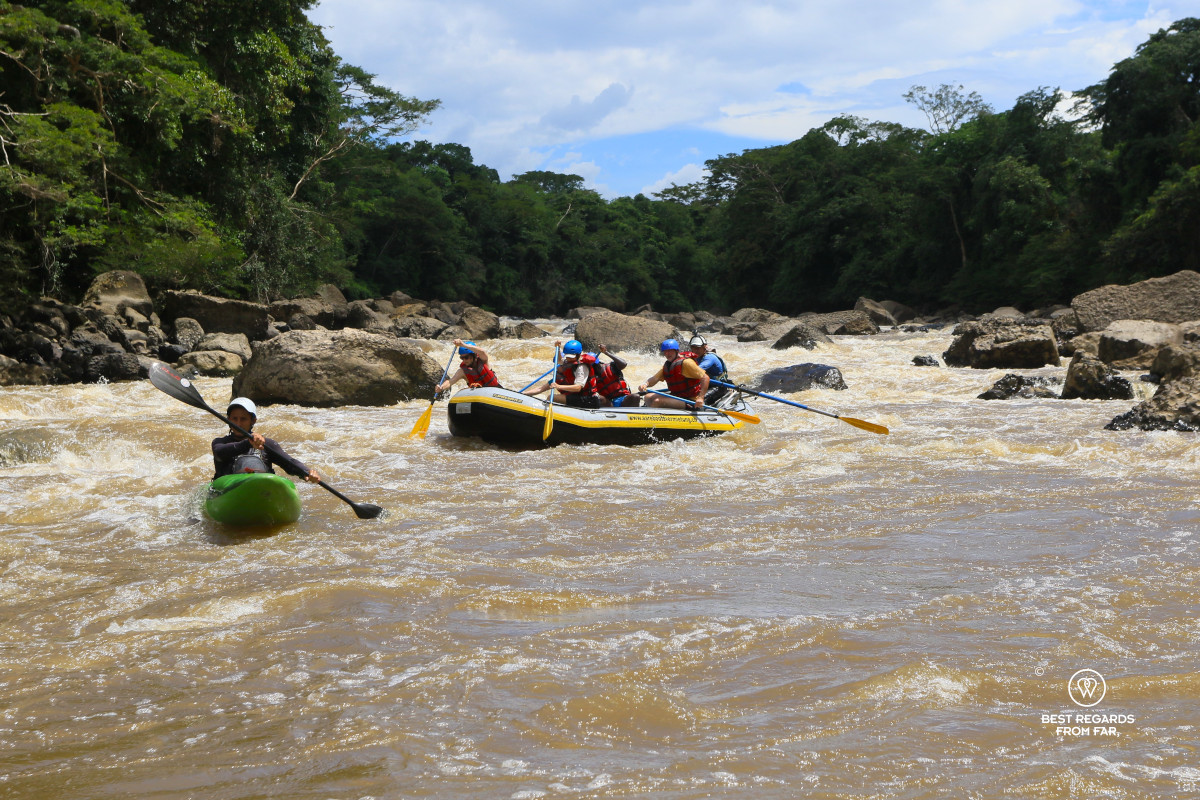 Rafting the rapids of the Rio Suarez in Colombia with the safety kayaker.