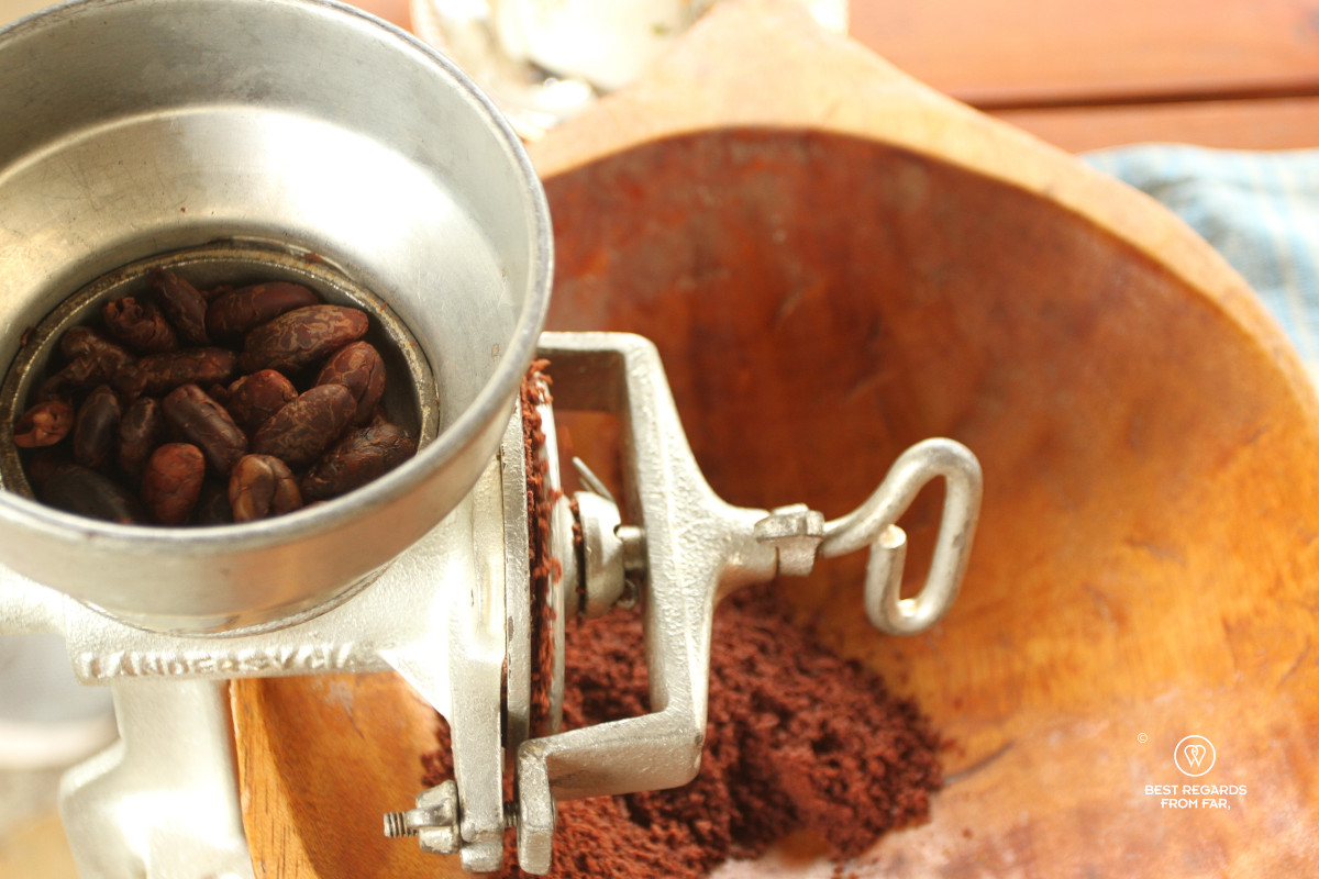 Grinding roasted cacao beans.
