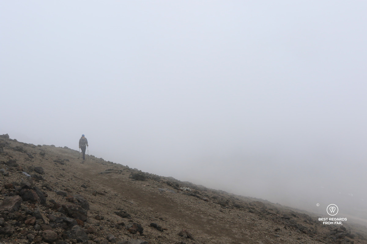 Hiking in the clouds along the volcanic slope of Cotopaxi.