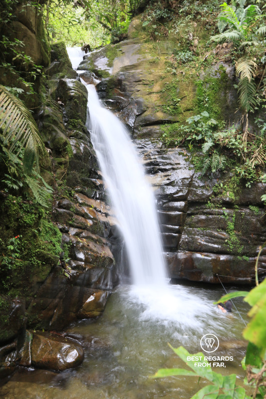 The waterfall of Santa Rita with a low shutter speed plunging into a rock pool around Salento in Colombia.