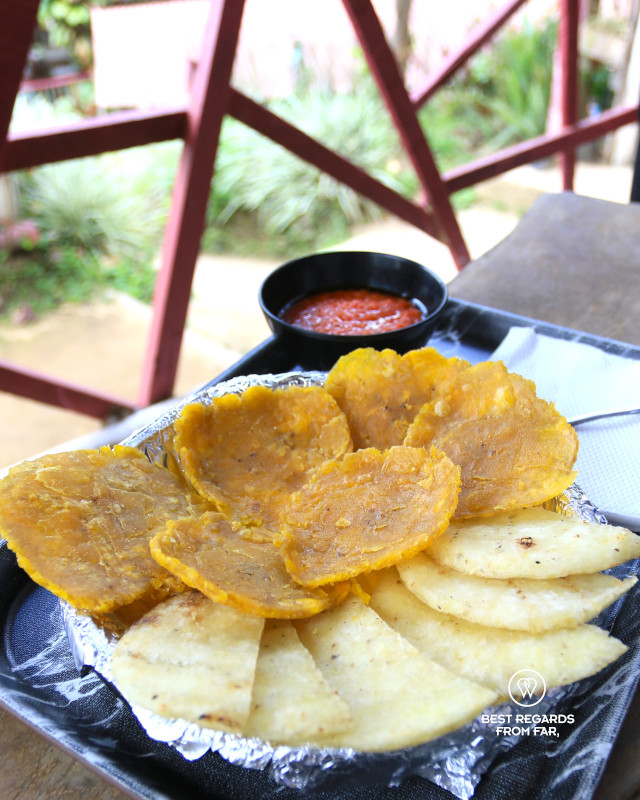 Patacon pisado, arepa and salsa.