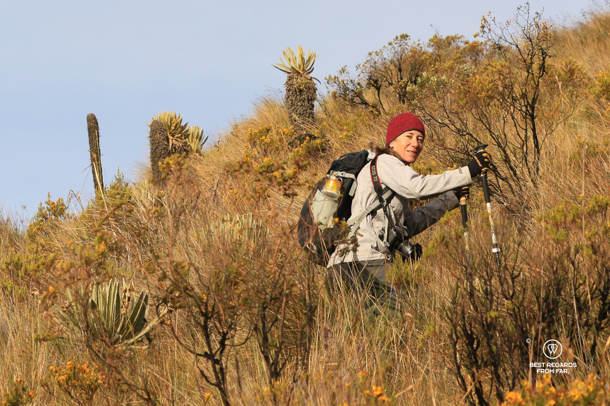 Photographer Claire Lessiau hiking at sunrise through the paramo in Los Nevados NP in Colombia.